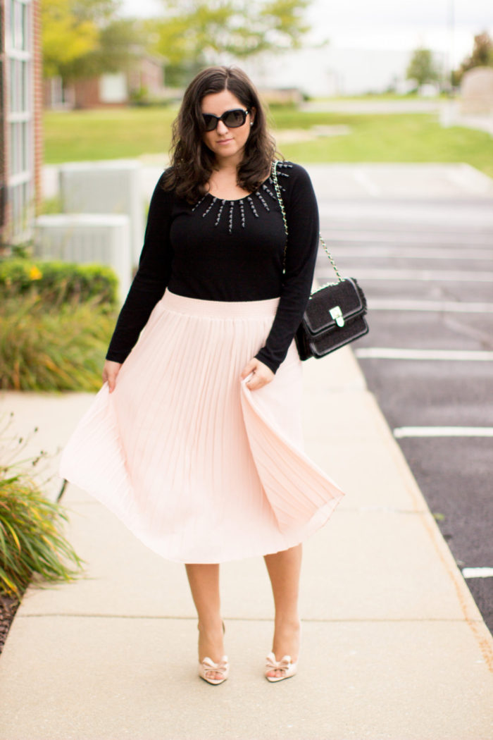 pink and black combination, pink midi skirt, black sweater, embellished sweater, bow pumps, girly fall outfit, work outfit idea,