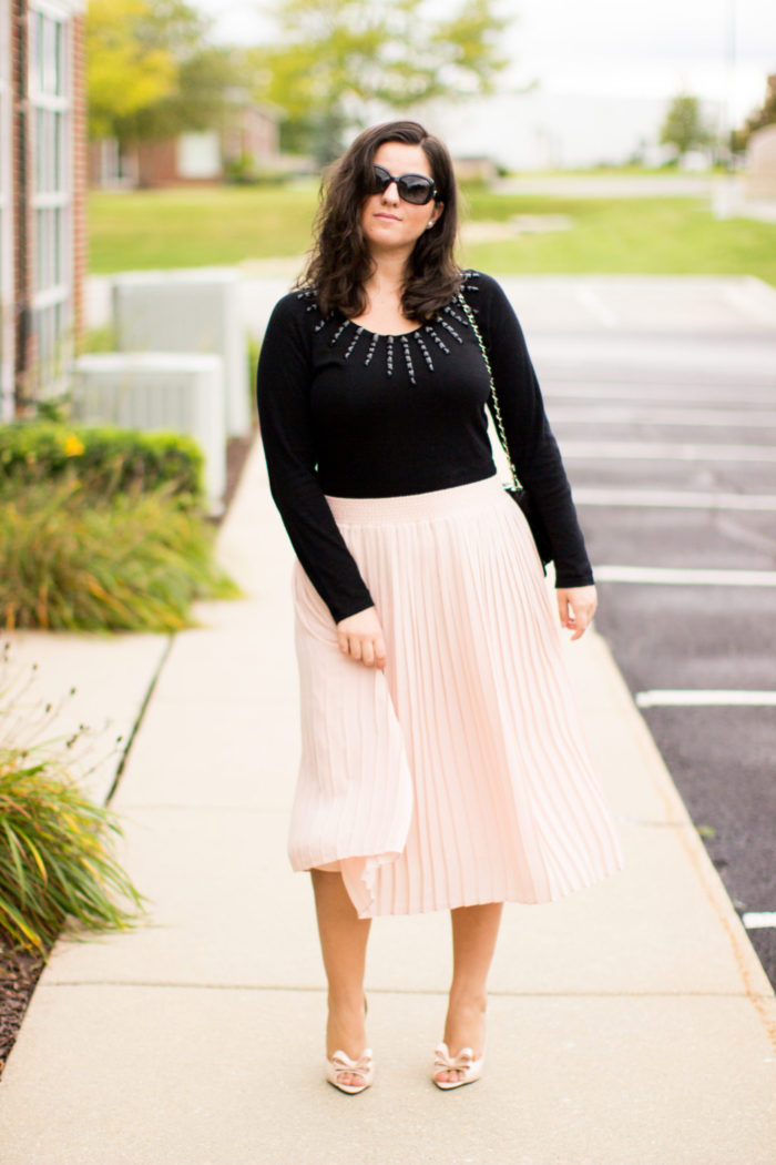 pink and black combination, pink midi skirt, black sweater, embellished sweater, bow pumps, girly fall outfit, work outfit idea,
