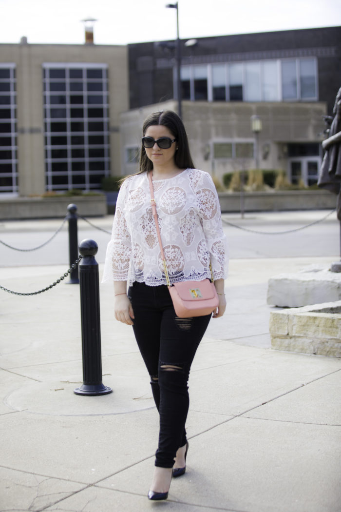 styling a white crochet top for Spring, bell sleeve lace top, black ripped skinny jeans, pink Tommy Hilfiger crossbody, nude bra,